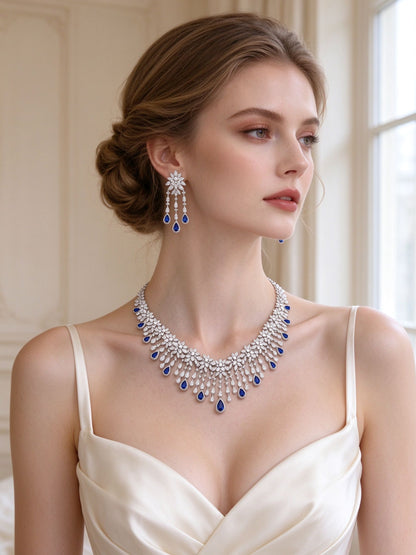 The Finley Bridal Parure – European bride wearing the silver starburst fringe necklace and chandelier earrings
