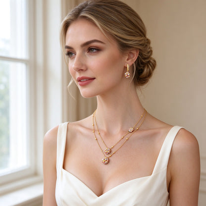 Western bride wearing The Sunbeam Crystal Parure layered tri-color flower necklace and single-flower drop earrings in soft window light