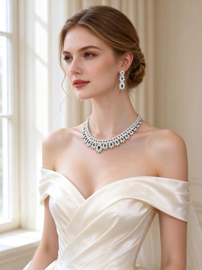 Bride in an ivory off-shoulder silk gown wearing The Kennedy Crystal Parure floral collar necklace and linear drop earrings
