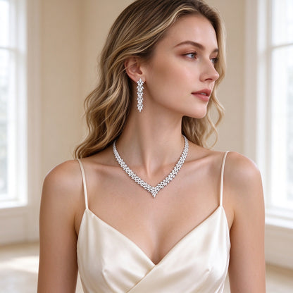 Model wearing The Nova Bridal Set V-necklace and drop earrings in ivory silk