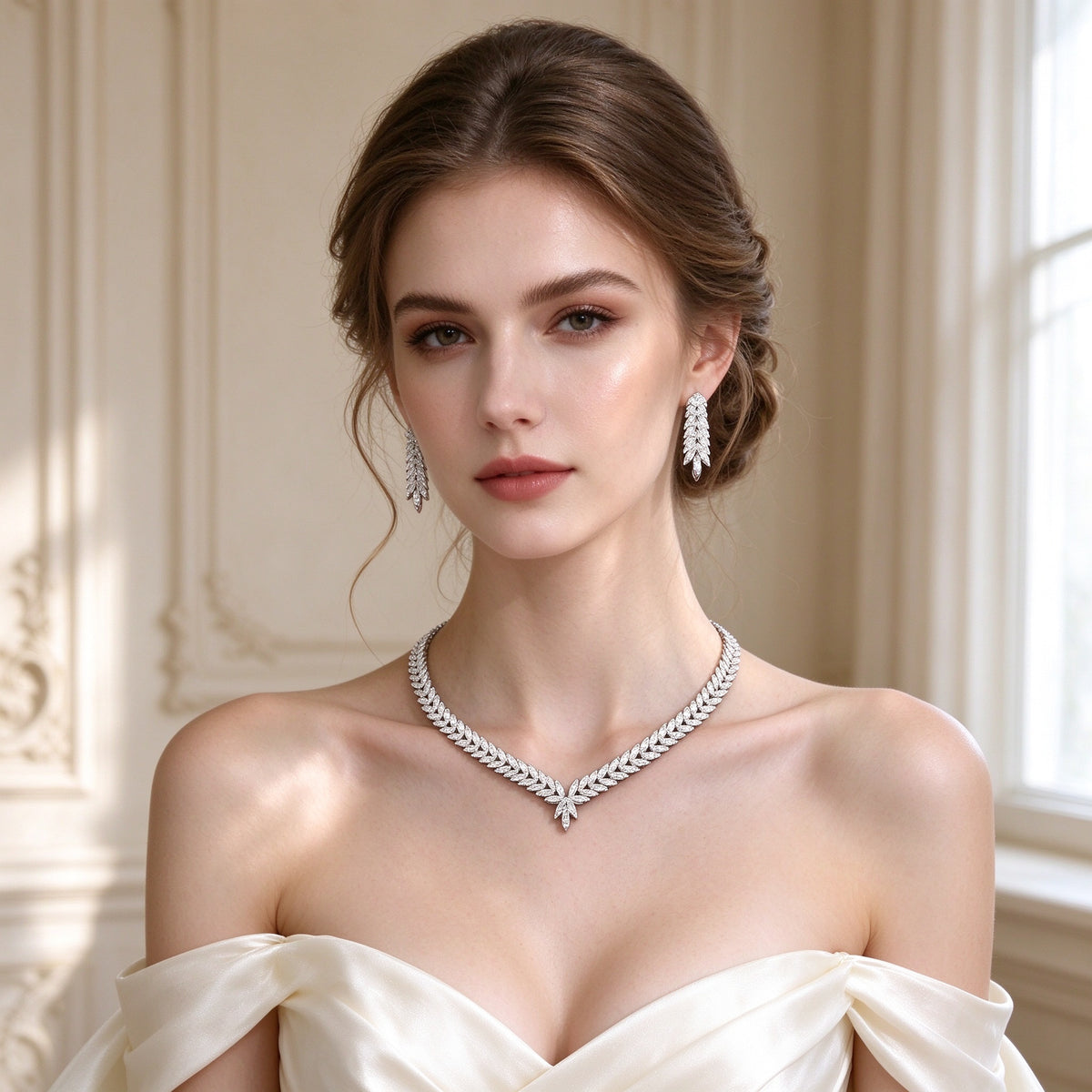 Bridal model wearing The Gardenia Wedding Suite marquise-leaf V-necklace and cascading leaf drop earrings