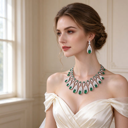 Bride wearing The Zinnia Bridal Parure fringe collar necklace and teardrop earrings with an ivory gown