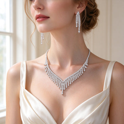 Close-up of The Moss V fringe necklace at the collarbone and long linear CZ drop earrings