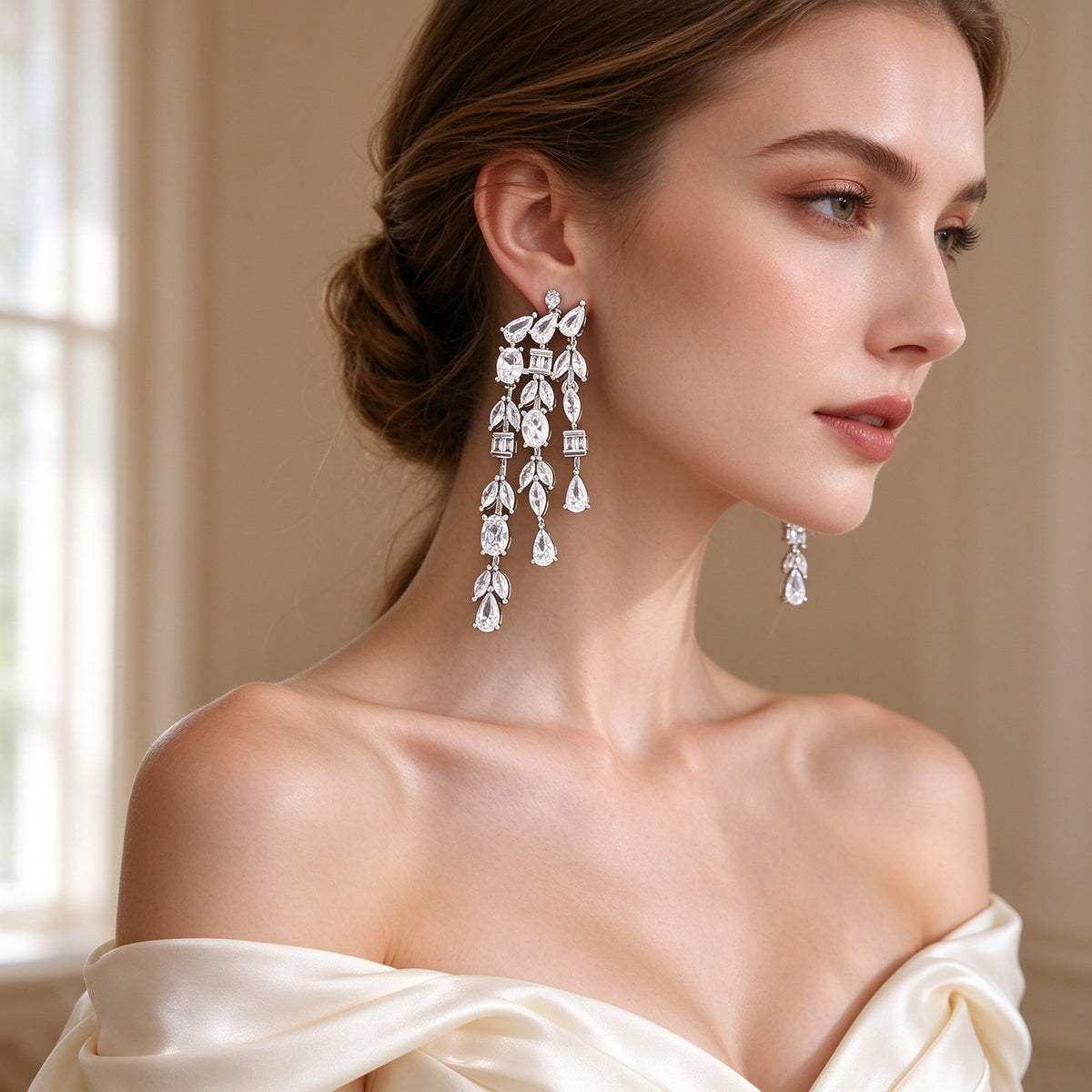 Close-up of The Comet Crystal Parure chandelier drop earrings on bridal ear
