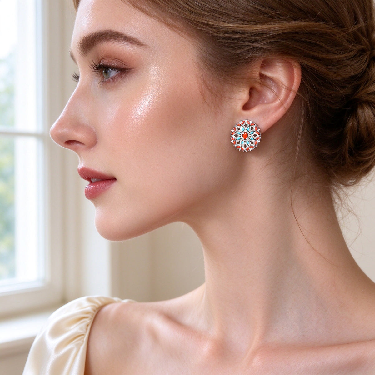 Close-up of The Bud Bridal Set round floral medallion stud earring — coral center with turquoise marquise petals and CZ halo — worn at a bride's ear