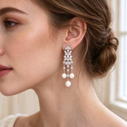 Close-up of linear pearl-tassel CZ drop earrings