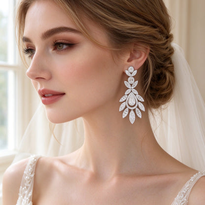 Close-up of Ash tiered chandelier leaf drop earrings in clear CZ