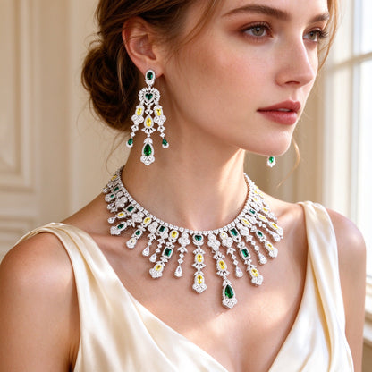 Close-up of The Dahlia Crystal Parure chandelier drop earrings and collar necklace worn by a bride