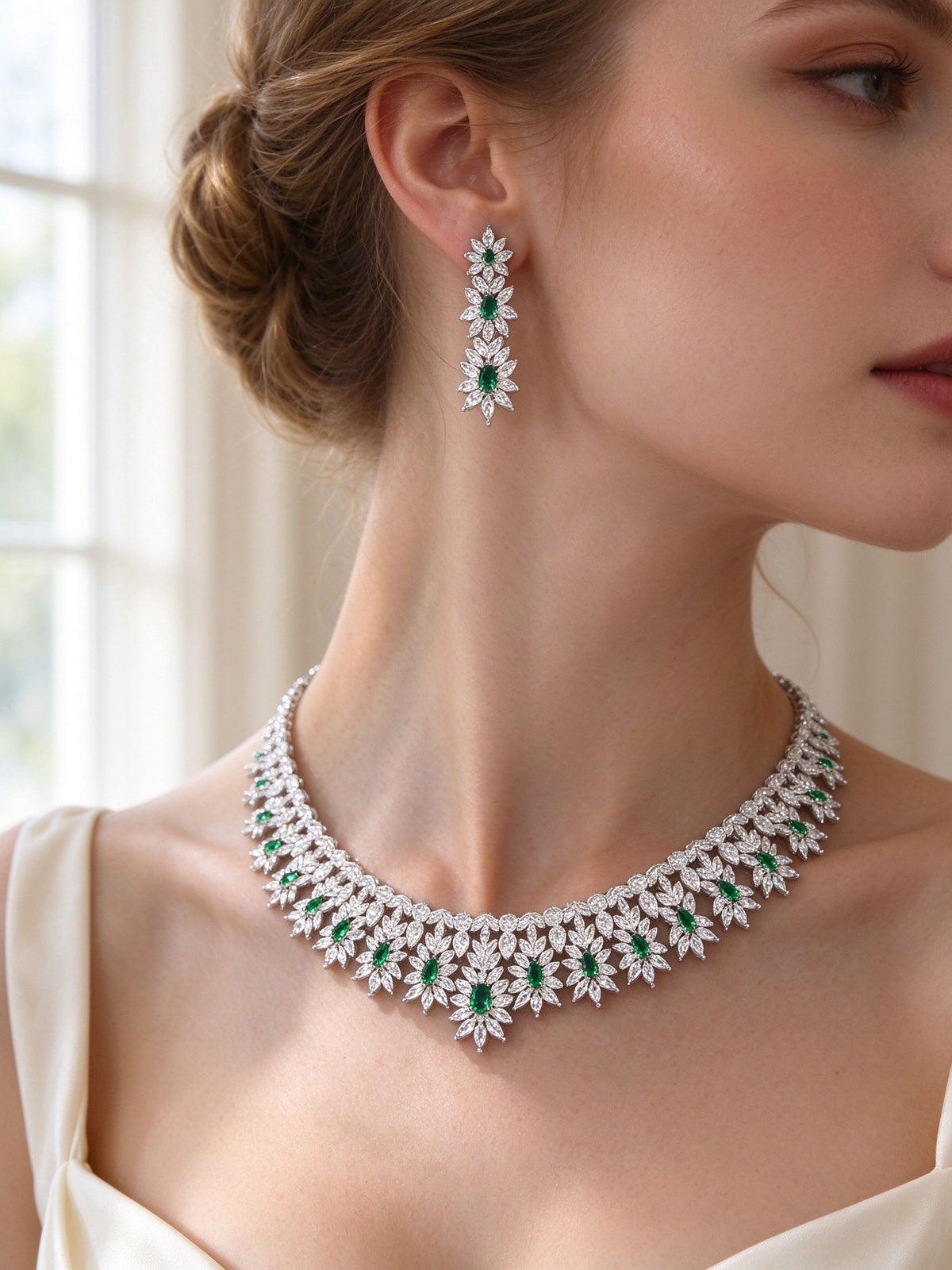 Side detail of The Kennedy Crystal Parure showing the stacked flower earring and graduating collar at the collarbone