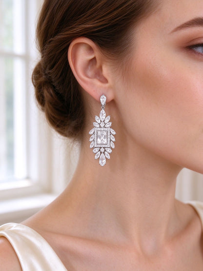 Close-up of bride's ear wearing The Diadem Bridal Parure radiating marquise CZ drop earring