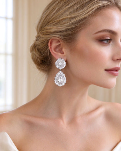 Close-up of the two-tier baguette sunburst pear-cut CZ drop earrings