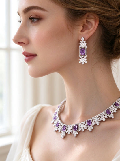 Side detail of The Arabella Bridal Parure showing the vertical drop earring and floral collar at the collarbone