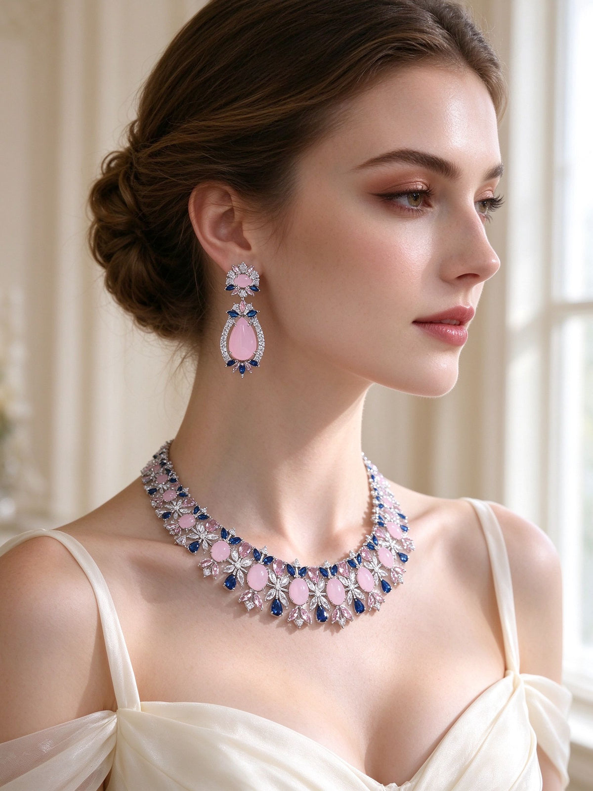 Side detail of The Calliope Bridal Set showing the teardrop earring and floral collar along the collarbone