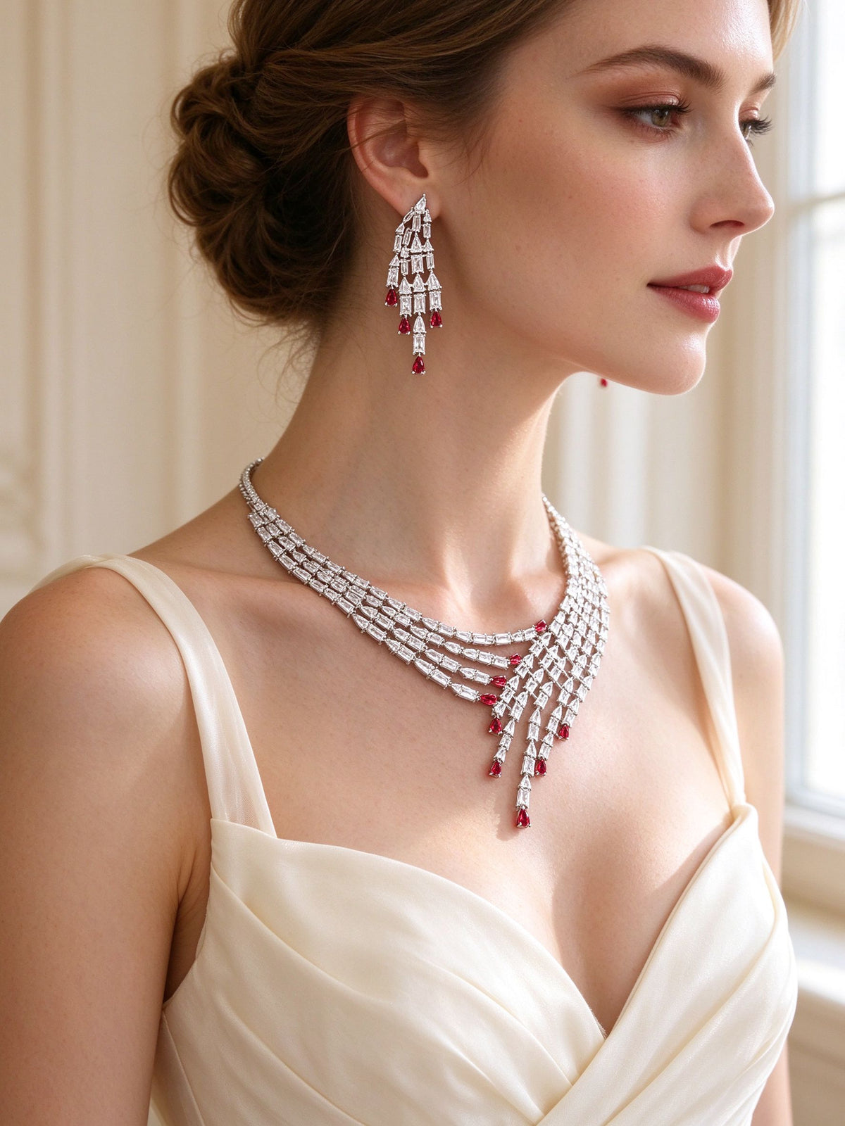 Side detail of The Maeve Bridal Parure showing the cascading chandelier earring and draped waterfall necklace along the collarbone