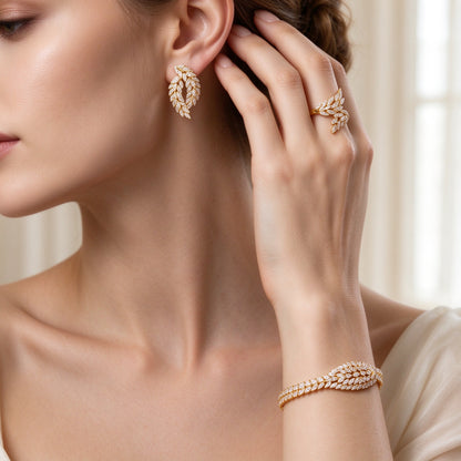 Close-up of marquise-leaf CZ earrings, ring and tennis bracelet