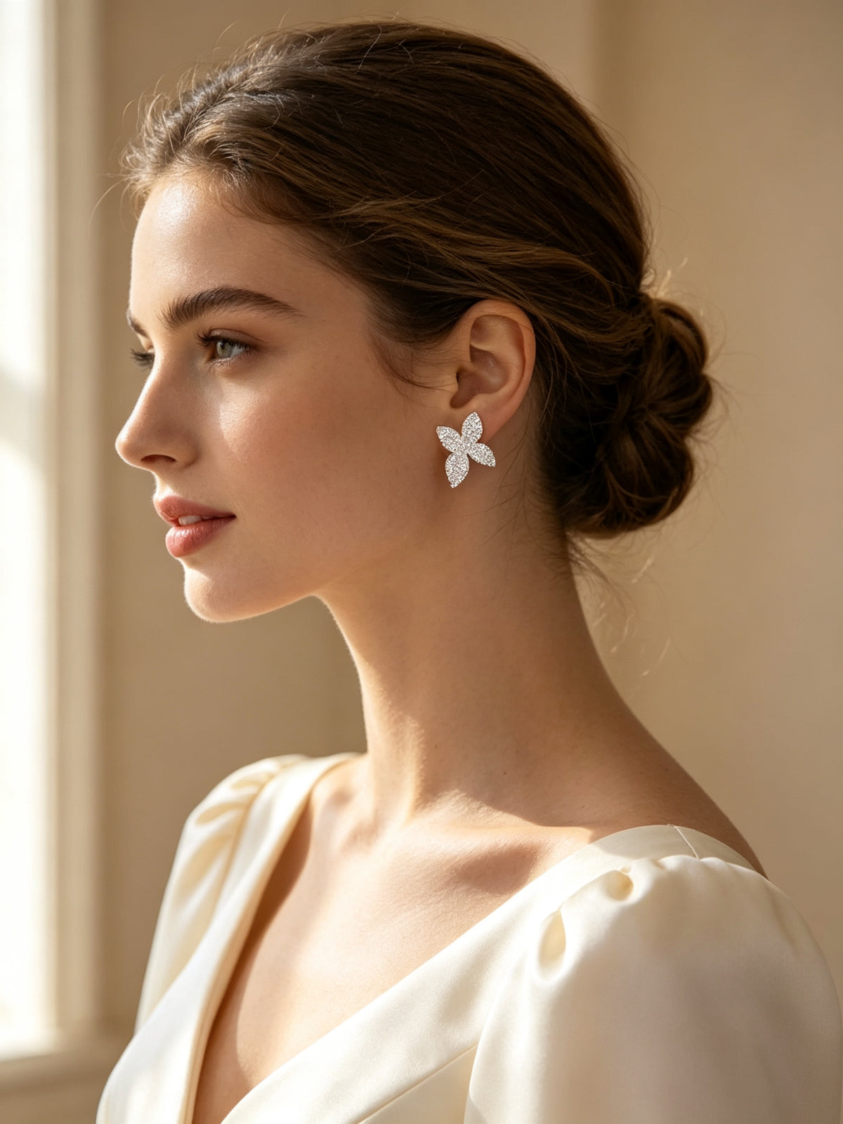 Side profile close-up of bride wearing The Stella pavé CZ orchid stud earring