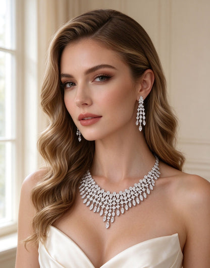 Close-up of The Dusk Wedding Suite — chandelier earrings and bib necklace