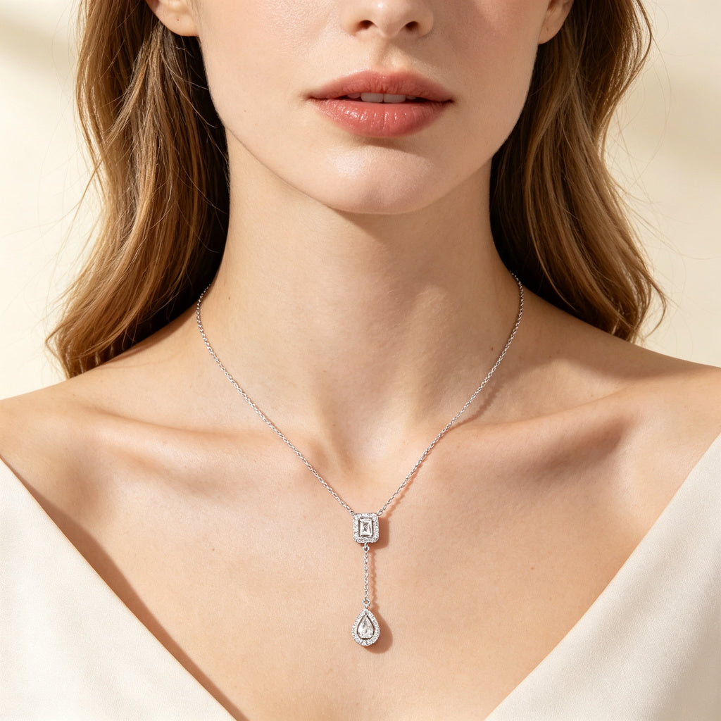 Close-up of woman's collarbone wearing CZ Y-drop necklace