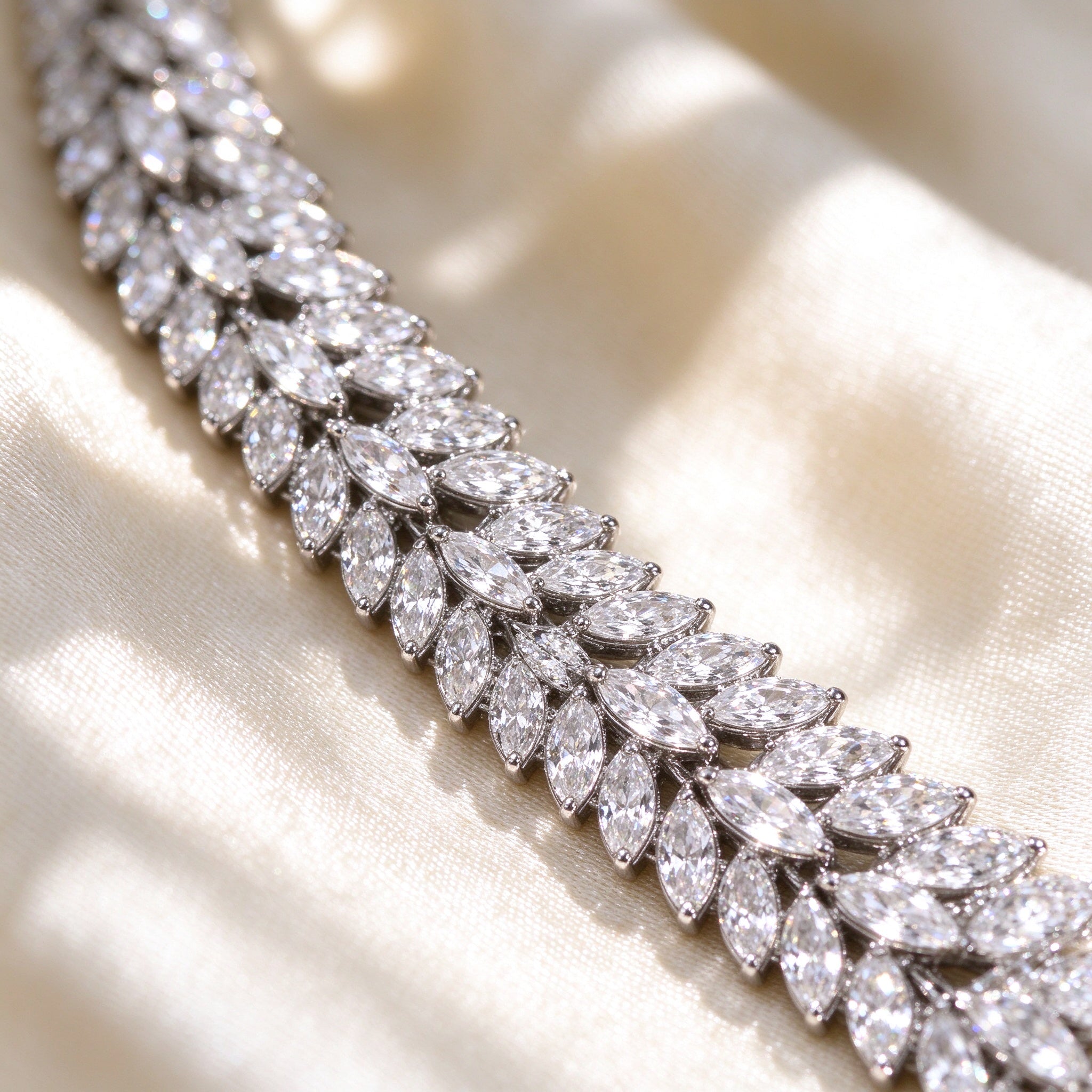 Macro of The Elowen Wedding Suite marquise-cut cubic zirconia laurel leaf detail