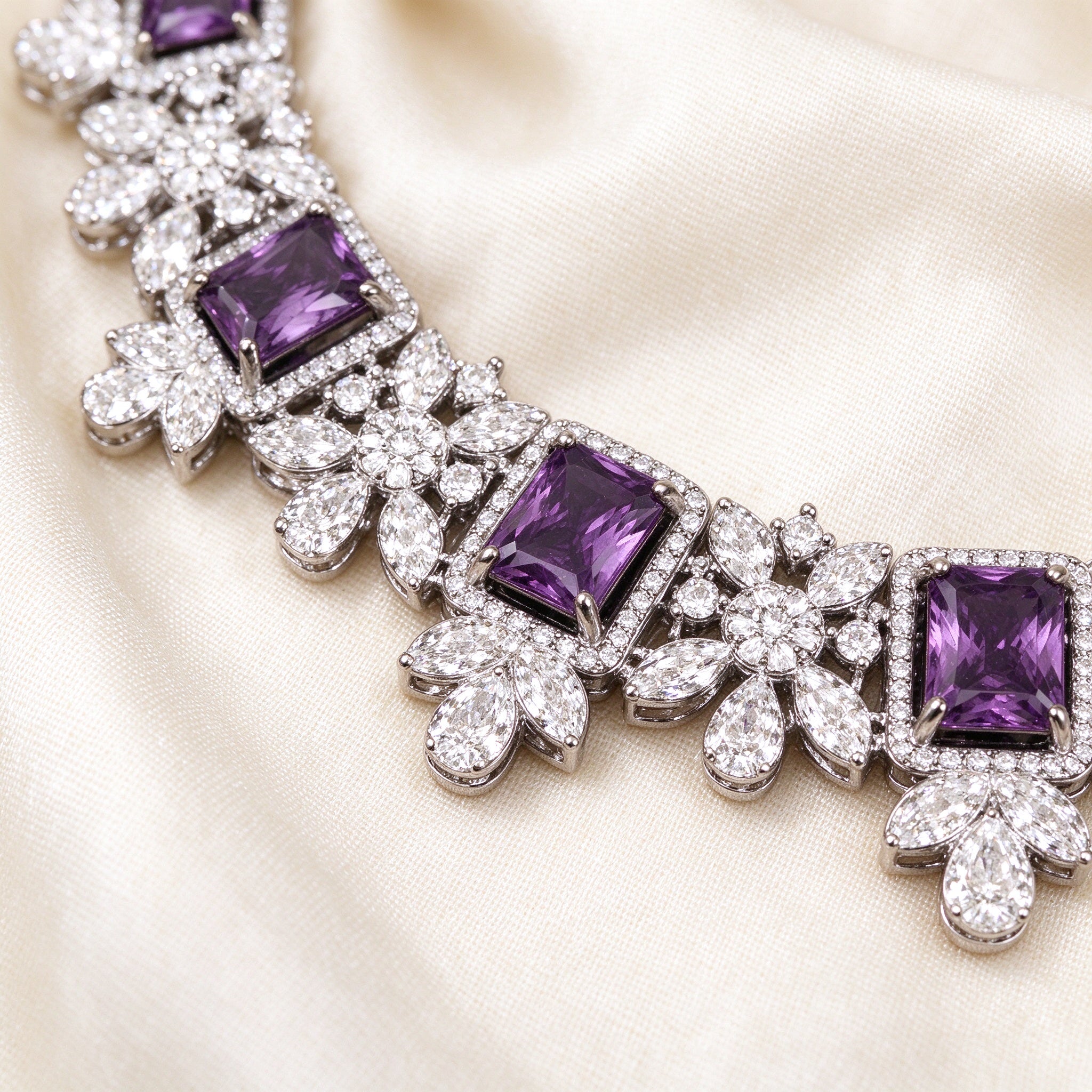 Macro detail of The Storm Wedding Suite amethyst CZ collar necklace