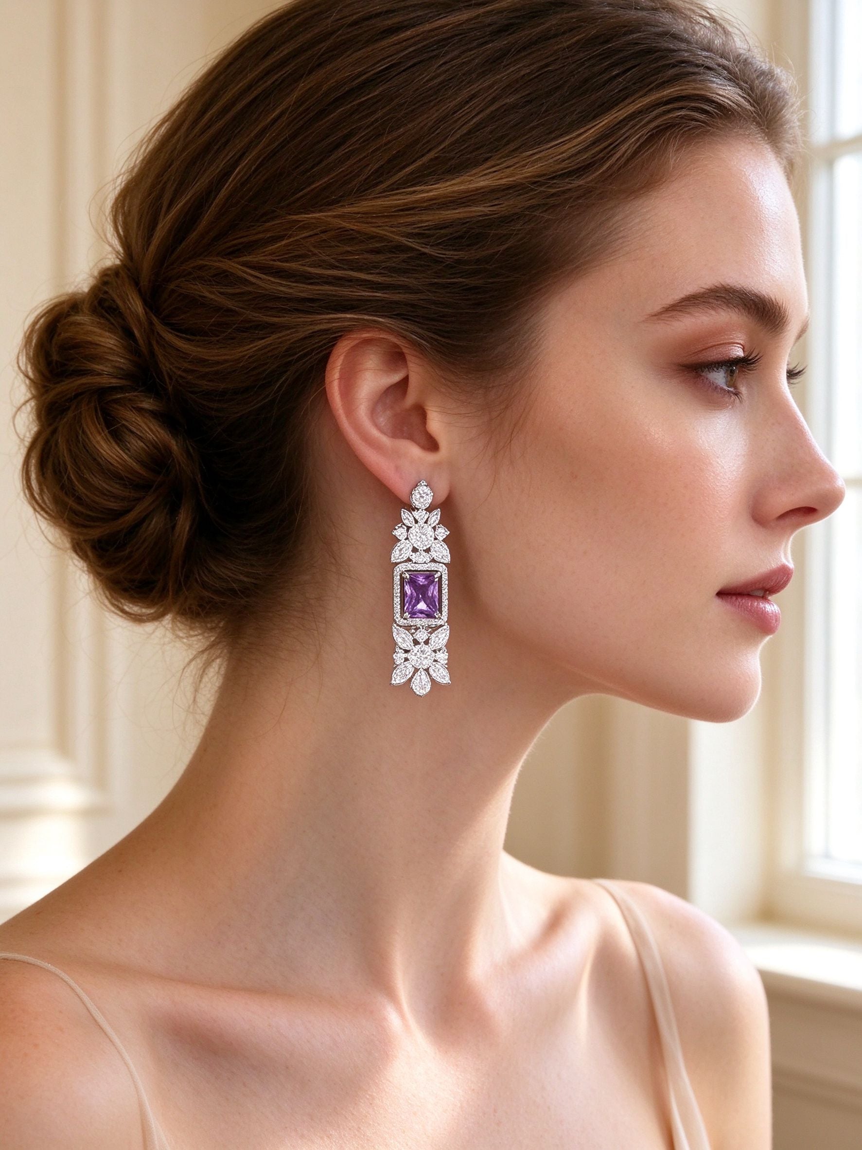 Close-up of The Storm Wedding Suite amethyst rectangular CZ drop earrings